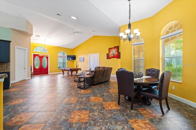 dining room with ceiling fan with notable chandelier, a healthy amount of sunlight, lofted ceiling, and billiards