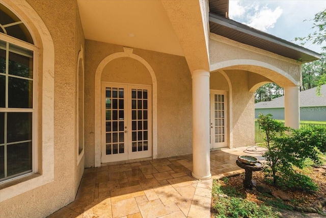 entrance to property with french doors and a patio