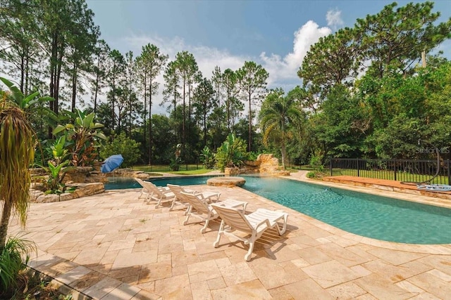 view of swimming pool featuring a patio