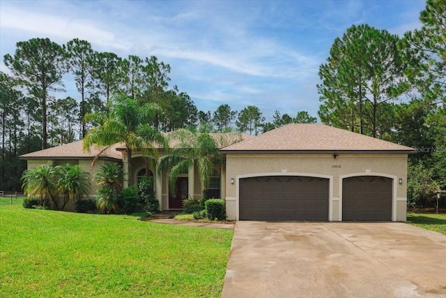 view of front of house featuring a front yard and a garage