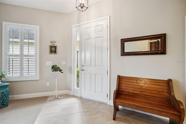 foyer entrance with light tile patterned floors