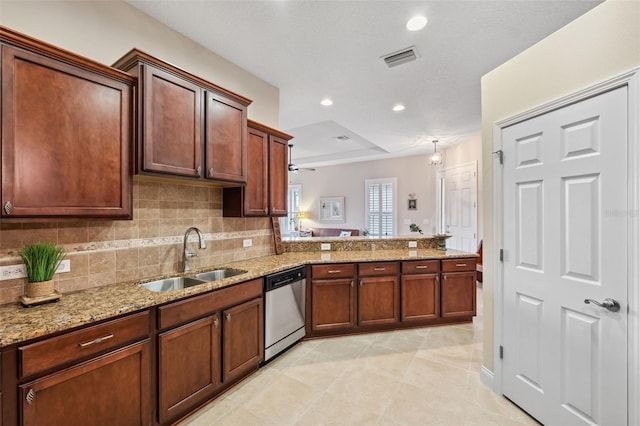 kitchen featuring light stone countertops, sink, stainless steel dishwasher, kitchen peninsula, and decorative backsplash