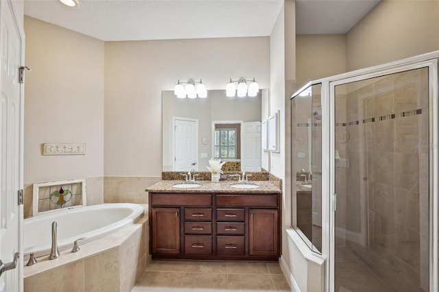 bathroom featuring tile patterned flooring, vanity, and independent shower and bath