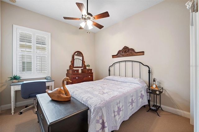 bedroom with ceiling fan and light carpet