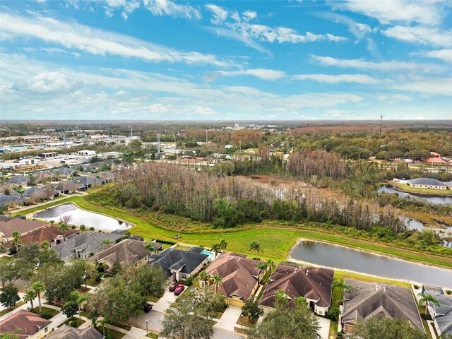 drone / aerial view with a water view