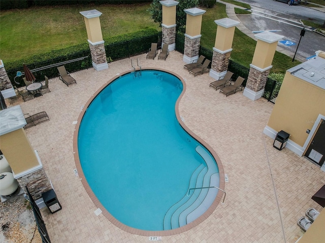 view of swimming pool featuring a patio area