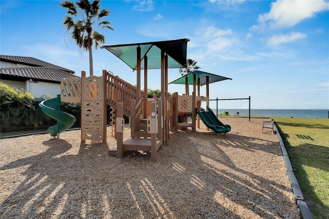 view of jungle gym featuring a water view