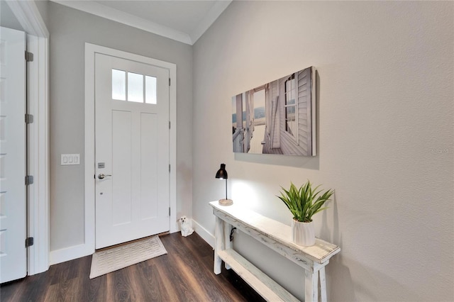 entryway with ornamental molding and dark wood-type flooring