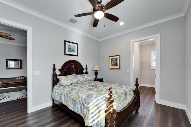 bedroom featuring a walk in closet, ceiling fan, crown molding, and dark hardwood / wood-style flooring