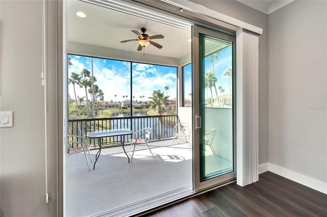 entryway with ceiling fan, dark wood-type flooring, and a water view