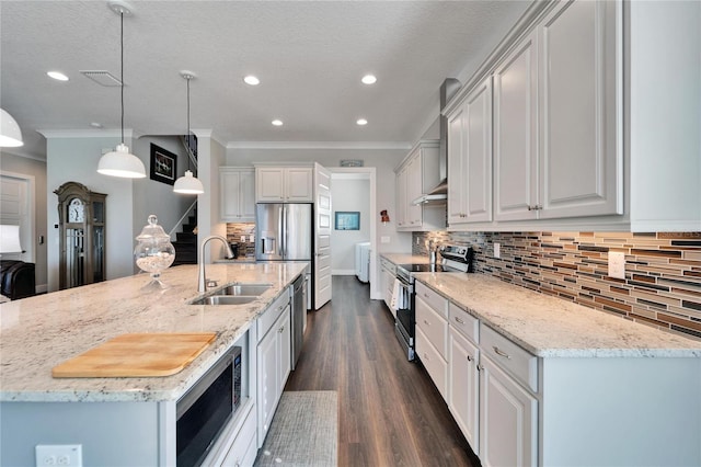 1308 Alhambra Dr, Apollo Beach, FL 33572 - kitchen featuring stainless steel appliances, recessed lighting, decorative backsplash, light stone counters, and dark wood finished floors