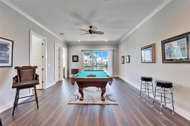 1308 Alhambra Dr, Apollo Beach, FL 33572 - playroom with ornamental molding, dark wood finished floors, a ceiling fan, billiards table, and a textured ceiling