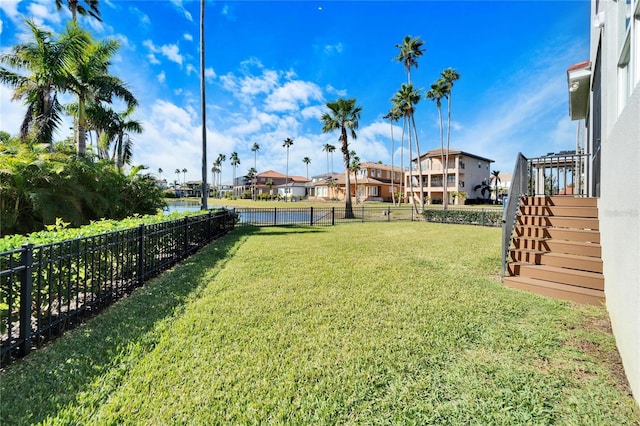 1308 Alhambra Dr, Apollo Beach, FL 33572 - fenced backyard with stairway, a water view, and a residential view