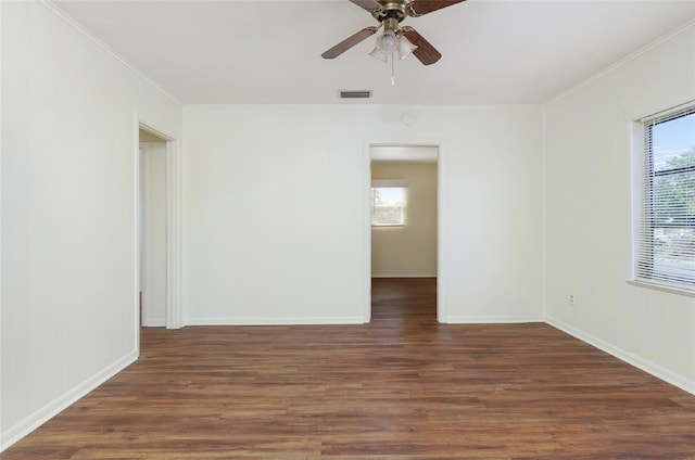 unfurnished room featuring ceiling fan, plenty of natural light, and dark hardwood / wood-style flooring