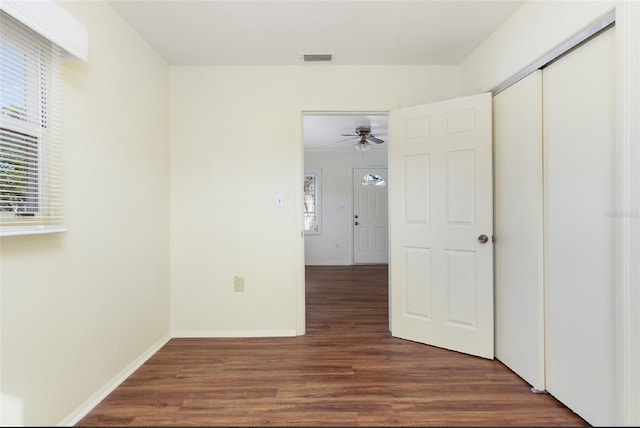 interior space featuring dark hardwood / wood-style floors and a closet