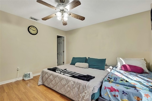 bedroom with light wood-type flooring and ceiling fan