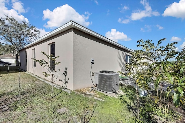 view of side of property featuring cooling unit