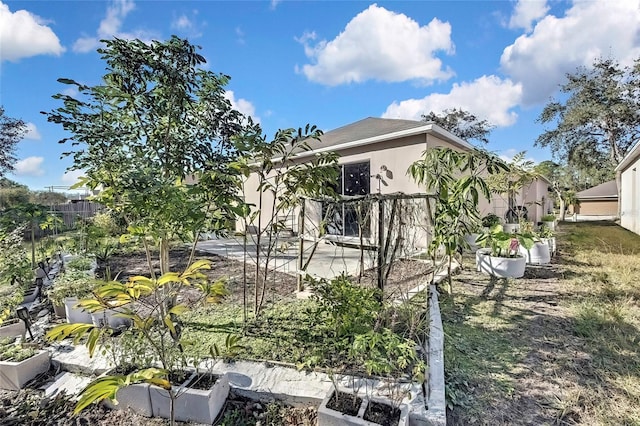 view of property exterior featuring a patio area