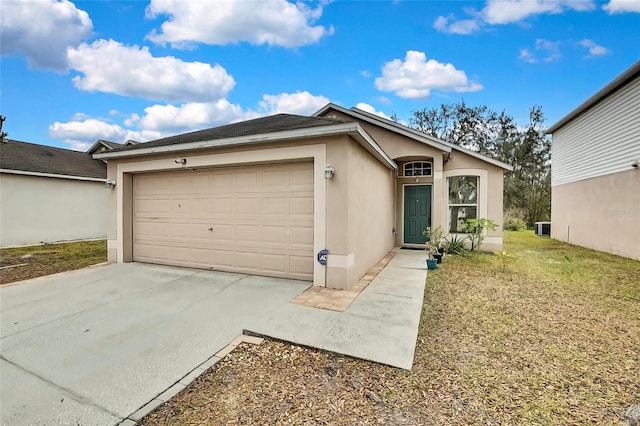 view of front of home with a front lawn and a garage