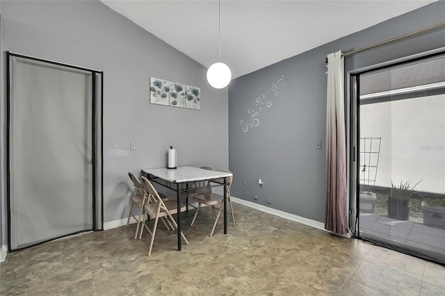 dining space with vaulted ceiling