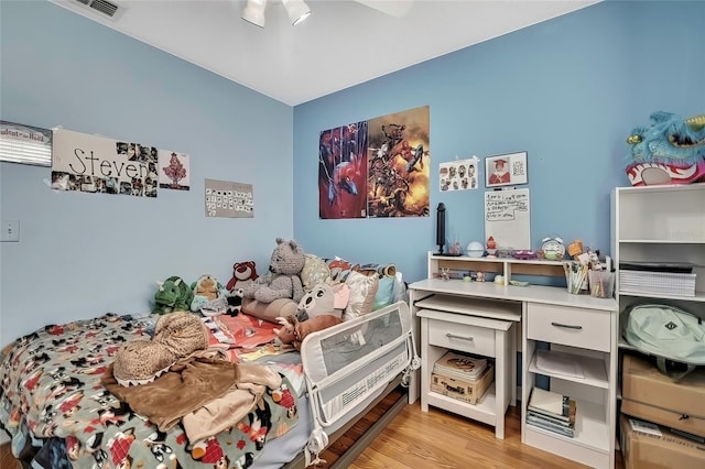 bedroom featuring light wood-type flooring and ceiling fan