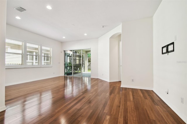 spare room with dark hardwood / wood-style floors