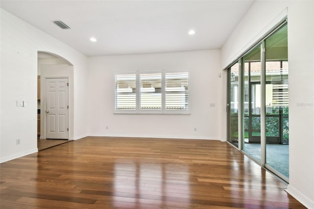 unfurnished room featuring hardwood / wood-style flooring