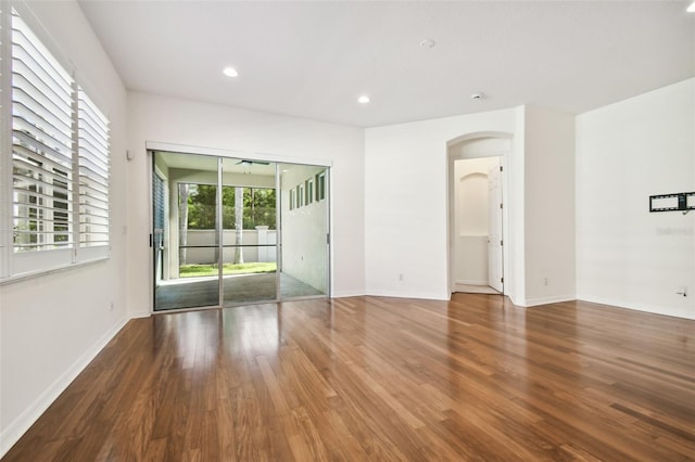 spare room with hardwood / wood-style flooring