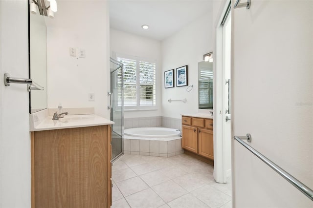 bathroom featuring vanity, tile patterned floors, and independent shower and bath