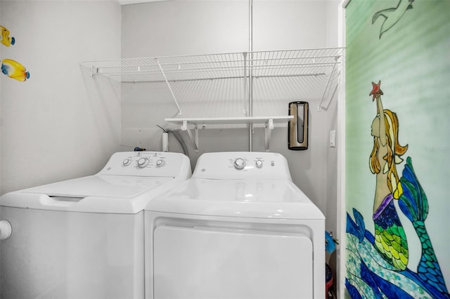 washroom with independent washer and dryer