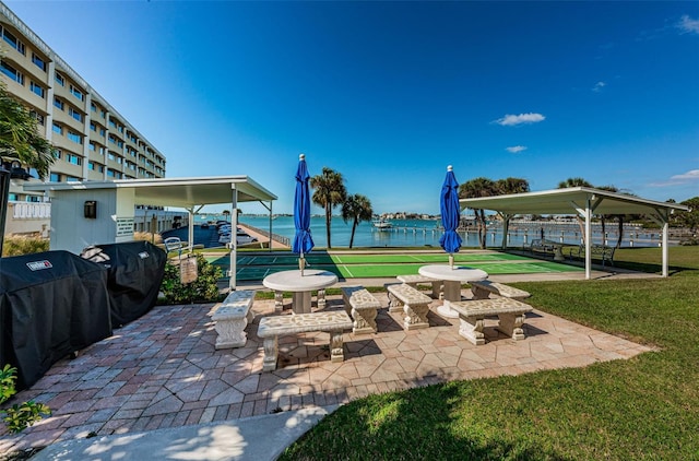 view of patio / terrace featuring shuffleboard and a grill