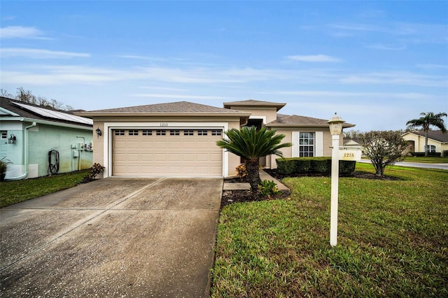 view of front of property featuring a garage and a front lawn