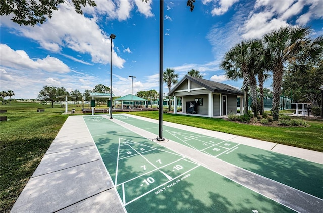 view of home's community with a yard