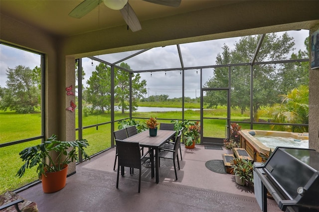 6516 Salt Creek Ave, Apollo Beach, FL 33572 - sunroom with a water view, ceiling fan, outdoor dining area, and a hot tub