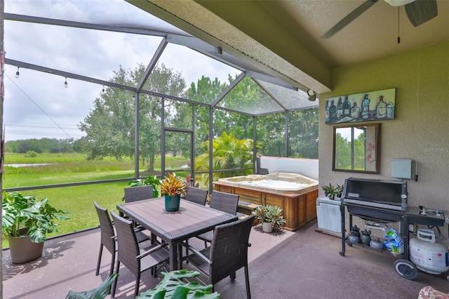 6516 Salt Creek Ave, Apollo Beach, FL 33572 - view of patio featuring a hot tub, ceiling fan, glass enclosure, and outdoor dining space