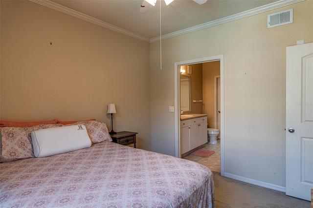 carpeted bedroom with ceiling fan, sink, crown molding, and ensuite bath