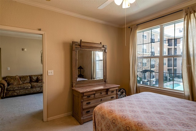 bedroom with multiple windows, ceiling fan, light colored carpet, and ornamental molding