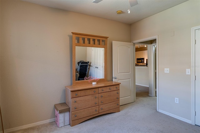 bedroom with light carpet and ceiling fan