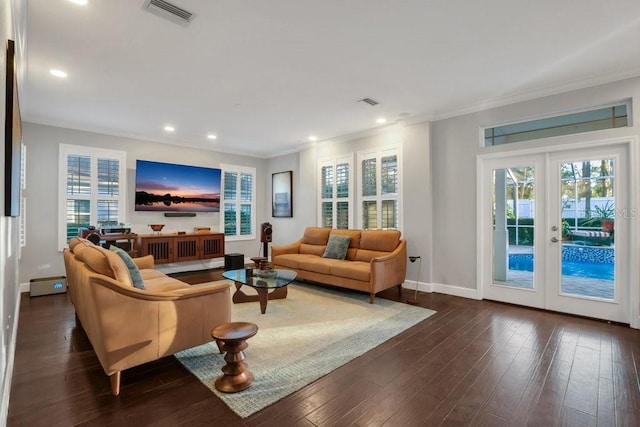 living room featuring french doors, dark hardwood / wood-style floors, and ornamental molding