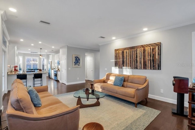 living room with ornamental molding and dark wood-type flooring