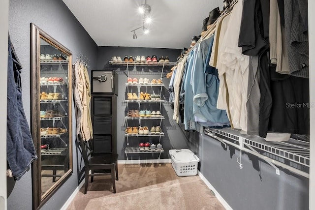 spacious closet featuring carpet floors