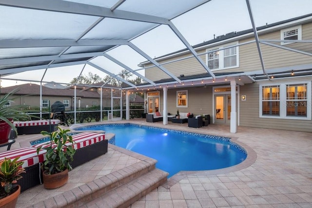 view of pool featuring a lanai, a patio, and an outdoor hangout area