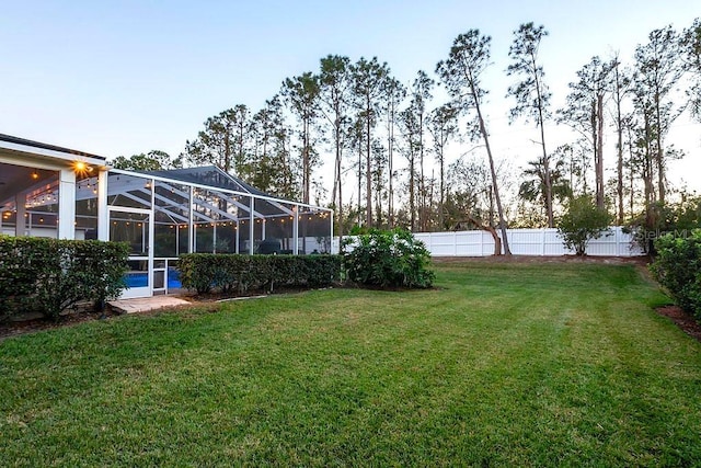 yard at dusk with glass enclosure