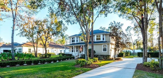 view of front of house with a front lawn and a porch