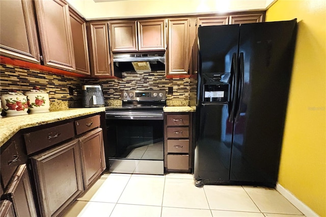 kitchen featuring stainless steel electric stove, backsplash, black refrigerator with ice dispenser, and light tile patterned floors