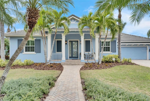 view of front facade featuring a garage and a front lawn