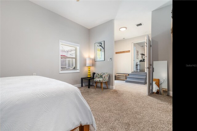 bedroom featuring visible vents, baseboards, and carpet flooring