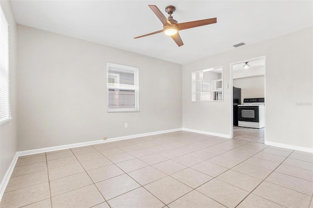 unfurnished living room with light tile patterned floors and ceiling fan