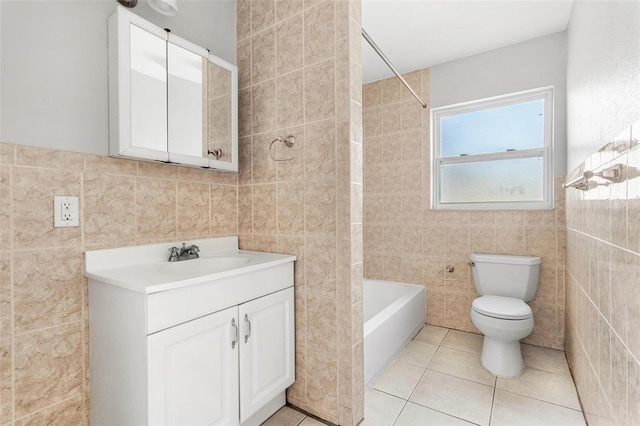 full bathroom with vanity, tile patterned flooring, toilet, tile walls, and shower / bathtub combination