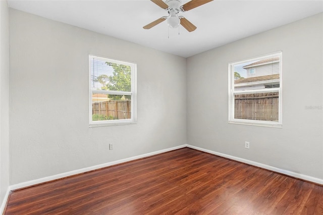 spare room featuring ceiling fan and hardwood / wood-style flooring